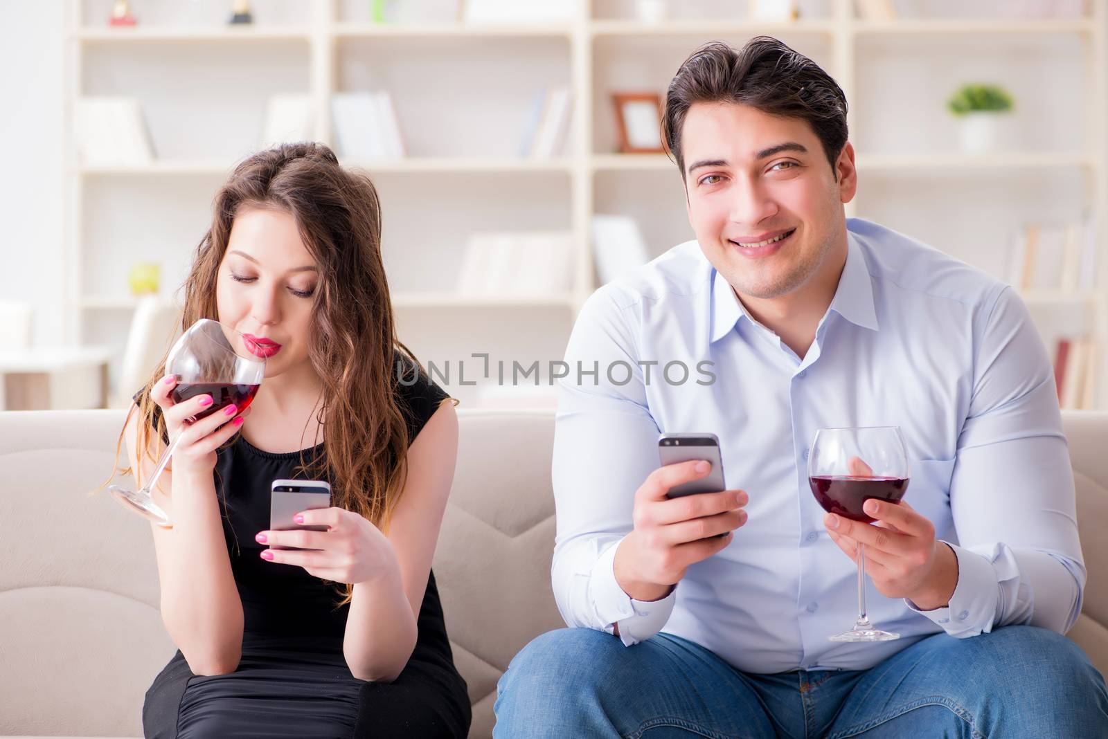 Young pair drinking wine in romantic concept