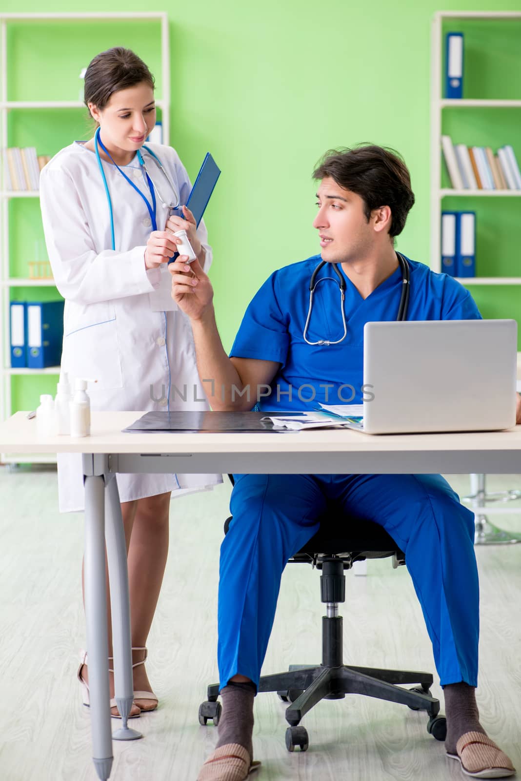 Woman and man doctors radiologists working at the clinic 