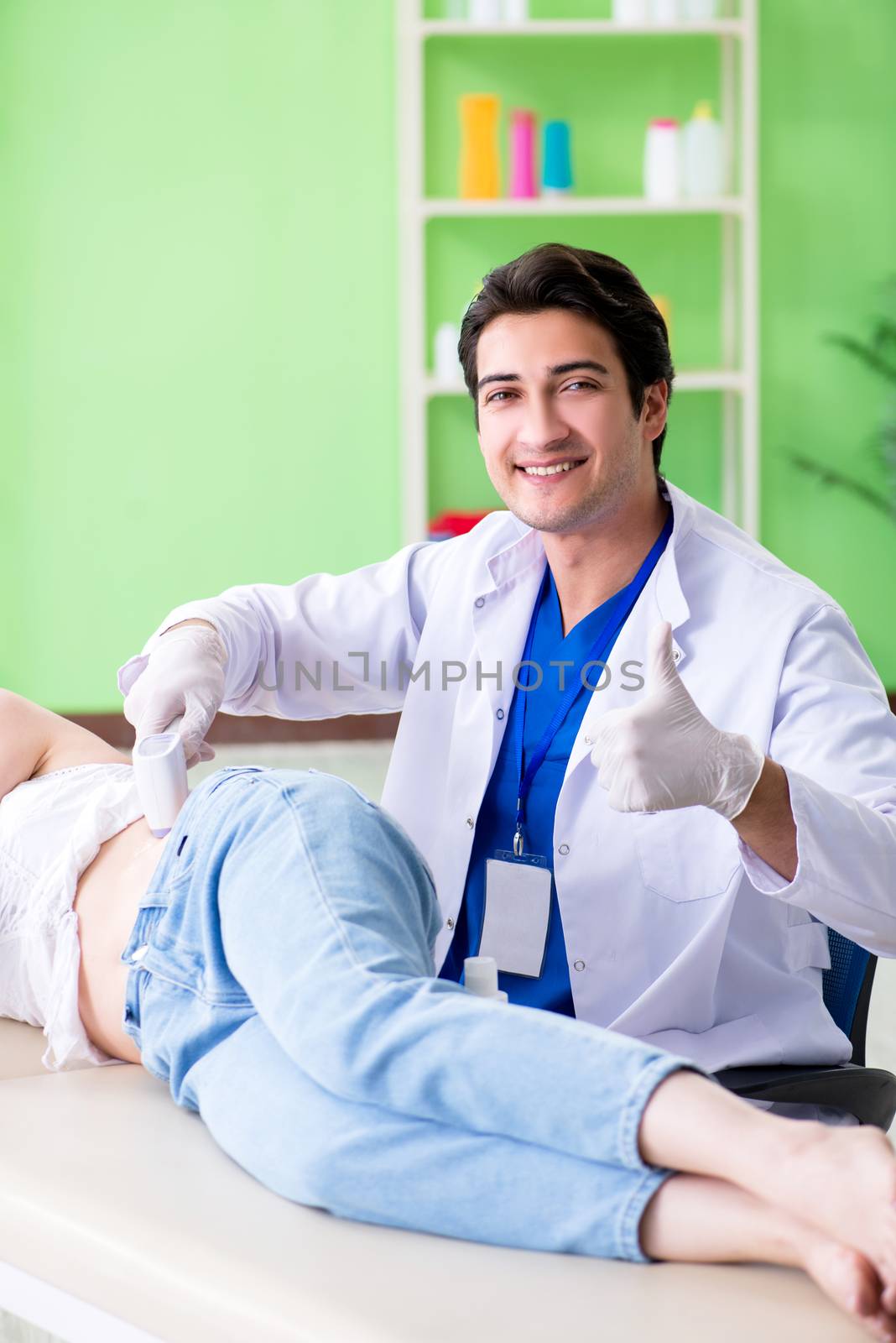 Pregnant woman visiting radiologyst for ultrasound 