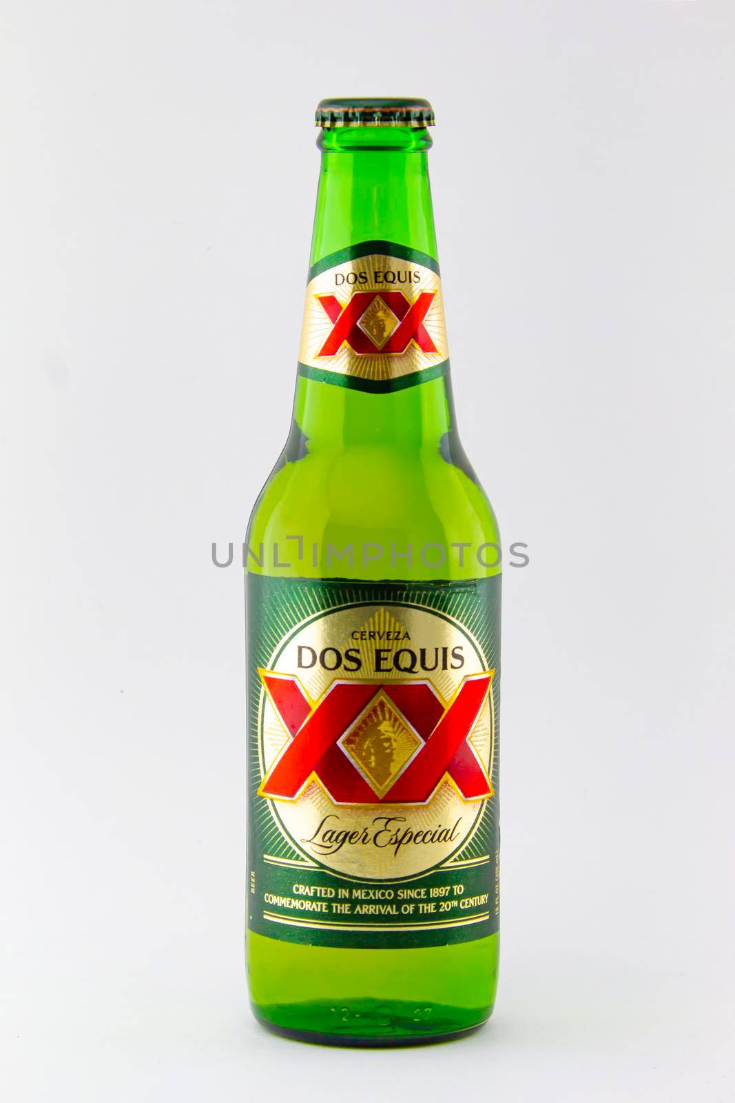 Calgary Alberta, Canada. Feb 15, 2021. A bottle of Dos Equis Lager beer on a white background by oasisamuel