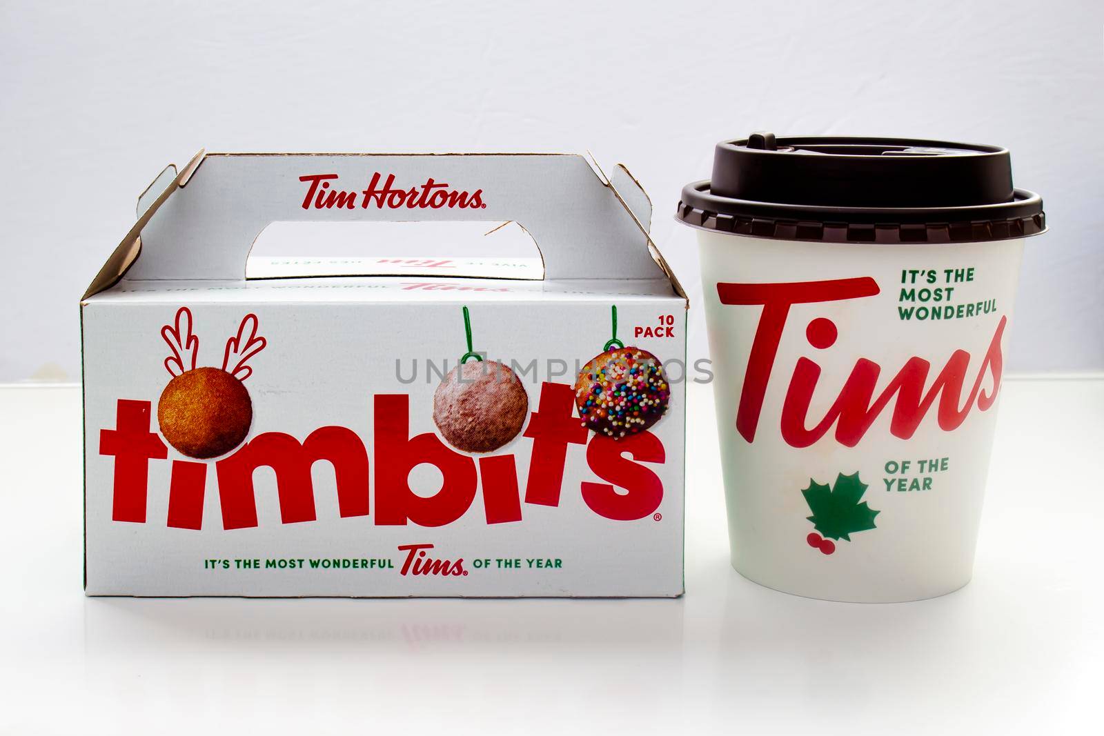 Calgary, Alberta. Canada. Jan 29, 2021. Christmas Tim Hortons coffee and Timbits box on a white background by oasisamuel