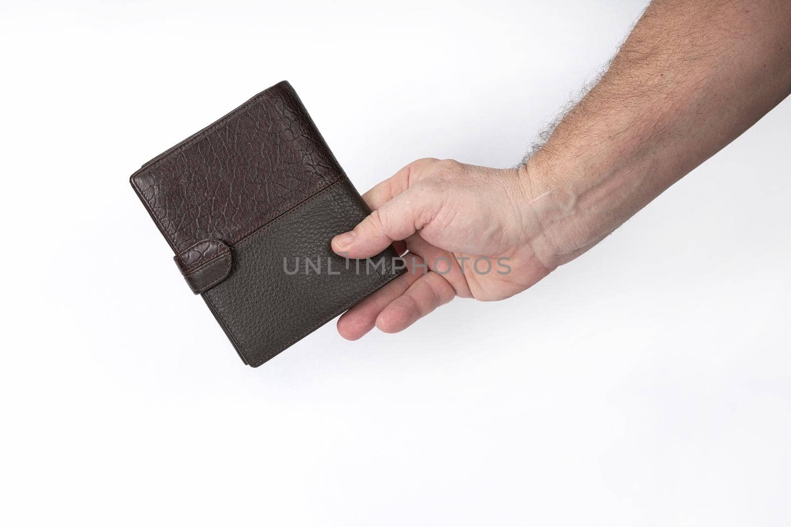 Hand holds a leather wallet on a white background, a template for designers. Close-up