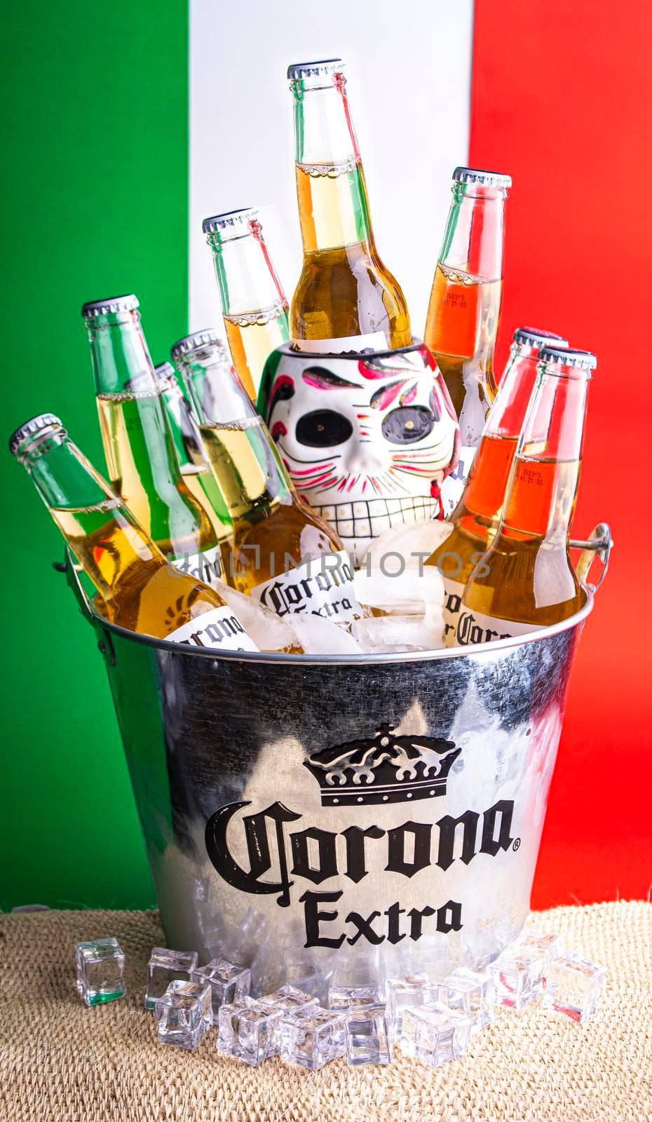 Mexico City, Mexico. September 25 2019. Corona beer on a bucket with a skull face for day of the dead and some ice cubes.