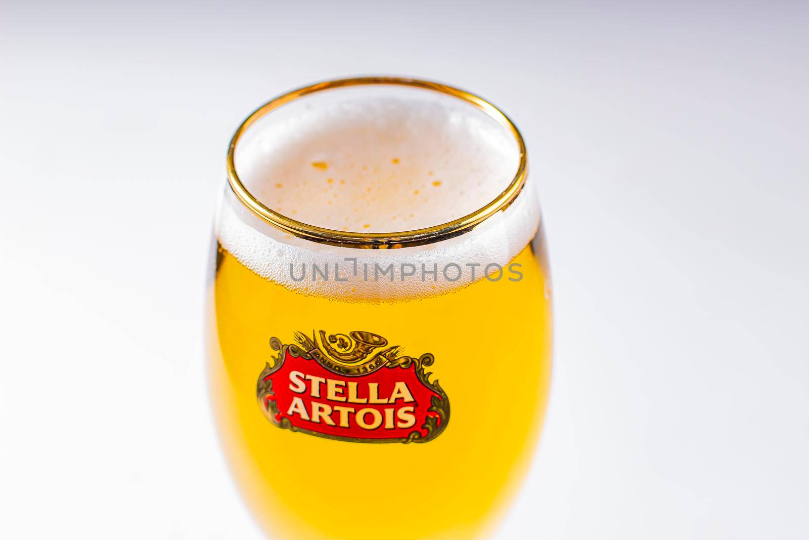 Close up of a cups of Stella Artois full of beer on a white background by oasisamuel