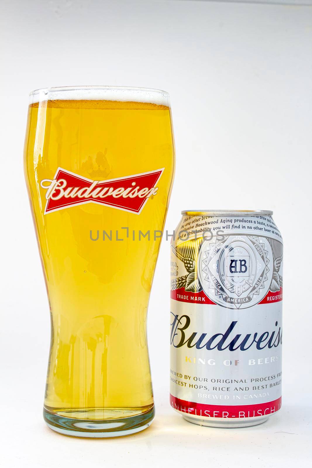 Calgary, Alberta. Canada. May 25, 2020. An isolated Budweiser beer pint with a can beer on the right on a white background