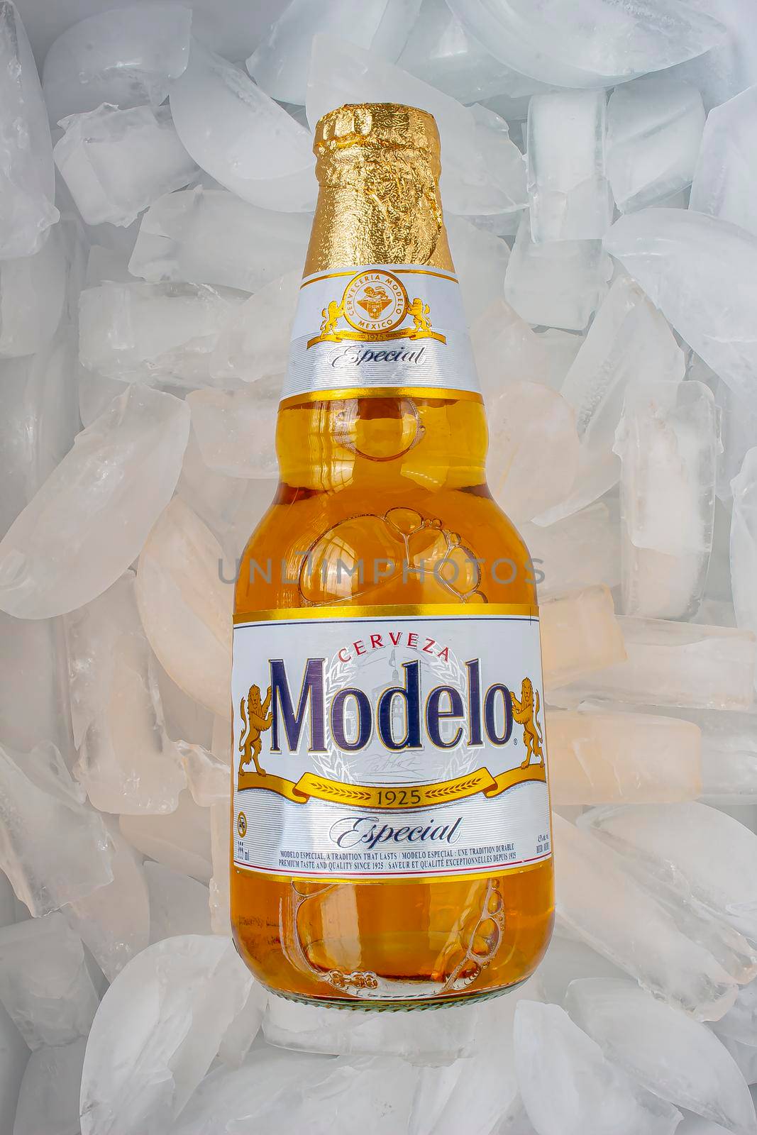 Calgary, Alberta, Canada. May 1, 2020. Modelo Especial beer bottle clear bright yellow colour on ice