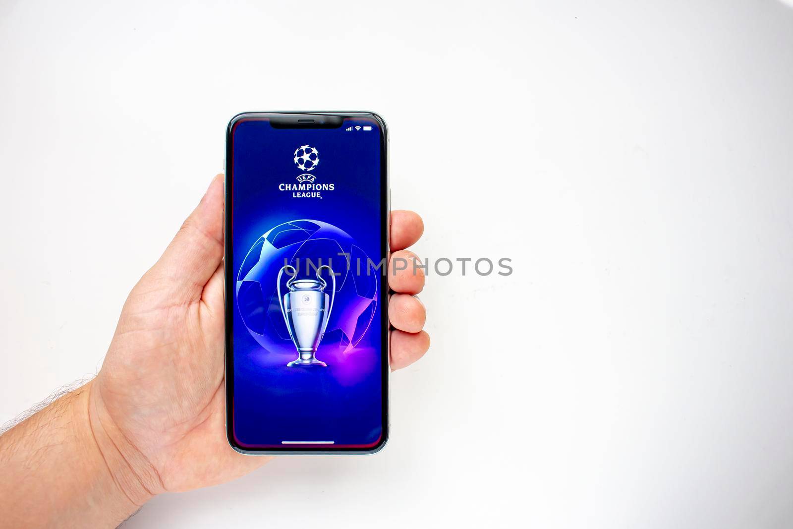 Calgary, Alberta, Canada. Aug 15, 2020. A person holding an iPhone 11 Pro Max with the UEFA Champions League application.