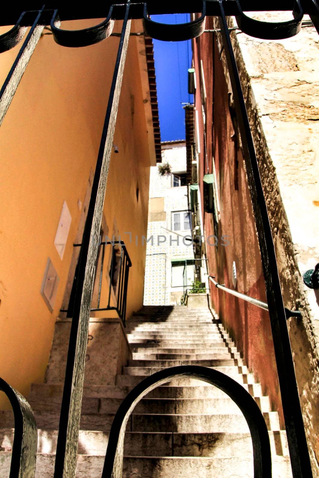 Narrow and colorful streets, majestic facades, windows and balconies of Lisbon, Portugal
