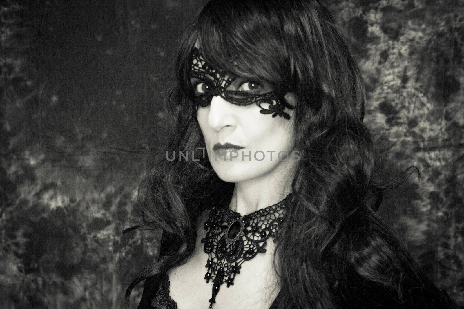 Woman disguised in gothic style for halloween party with mask