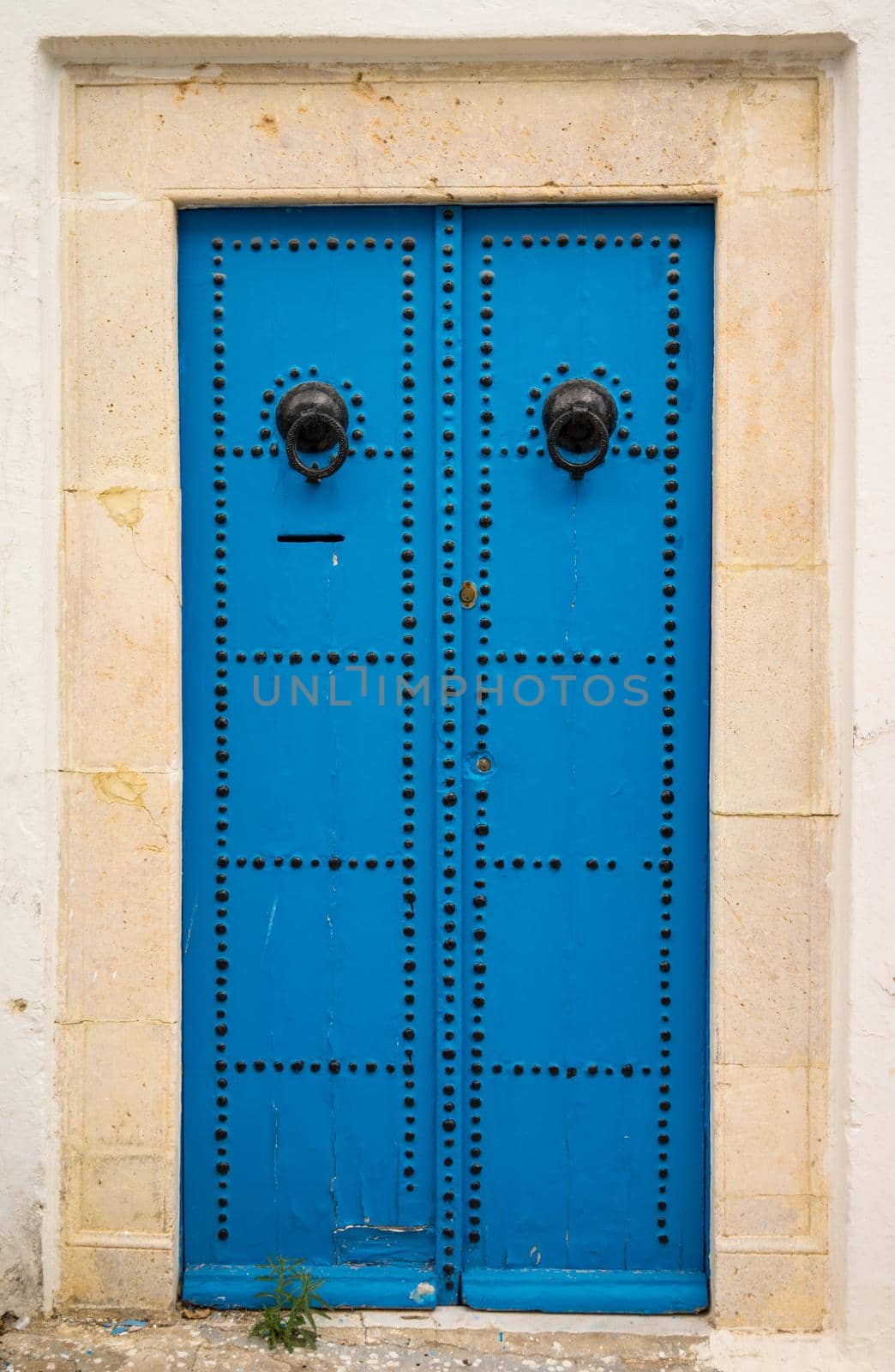 Aged traditional door with from Sidi Bou Said in Tunisia. Tunisian culture