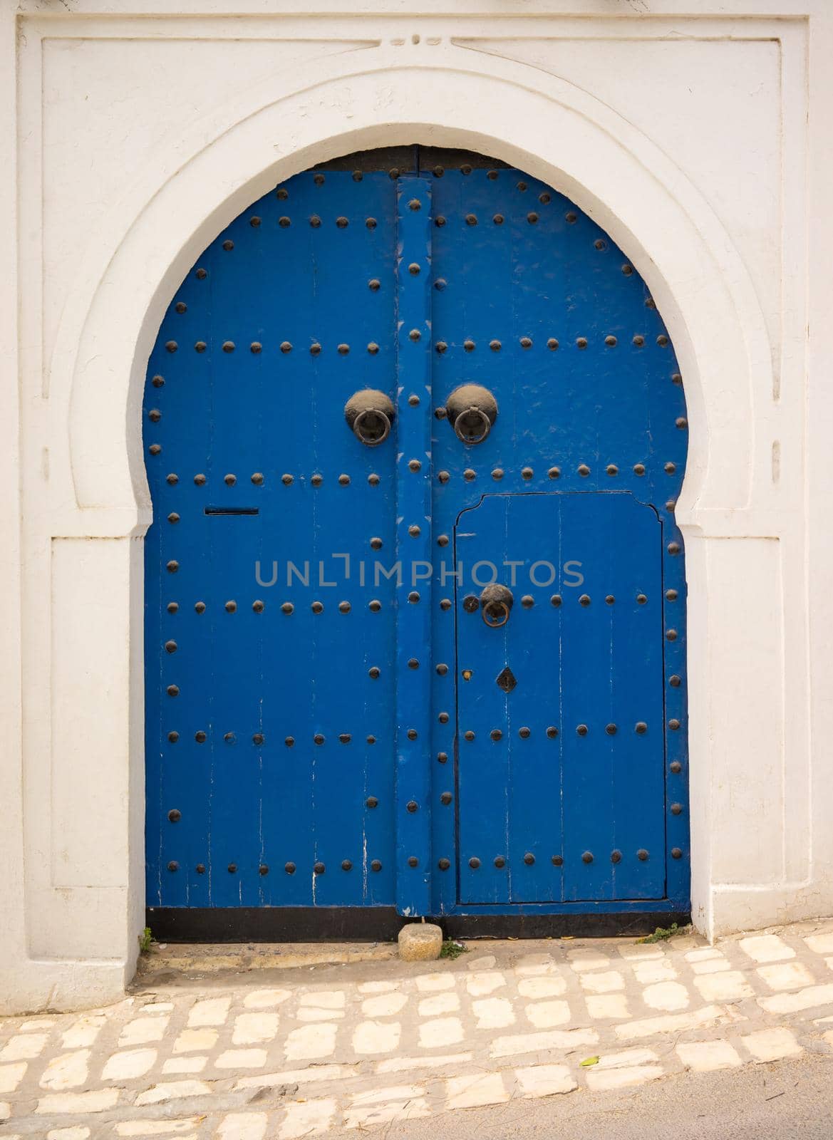 Blue door in Andalusian style from Sidi Bou Said in Tunisia