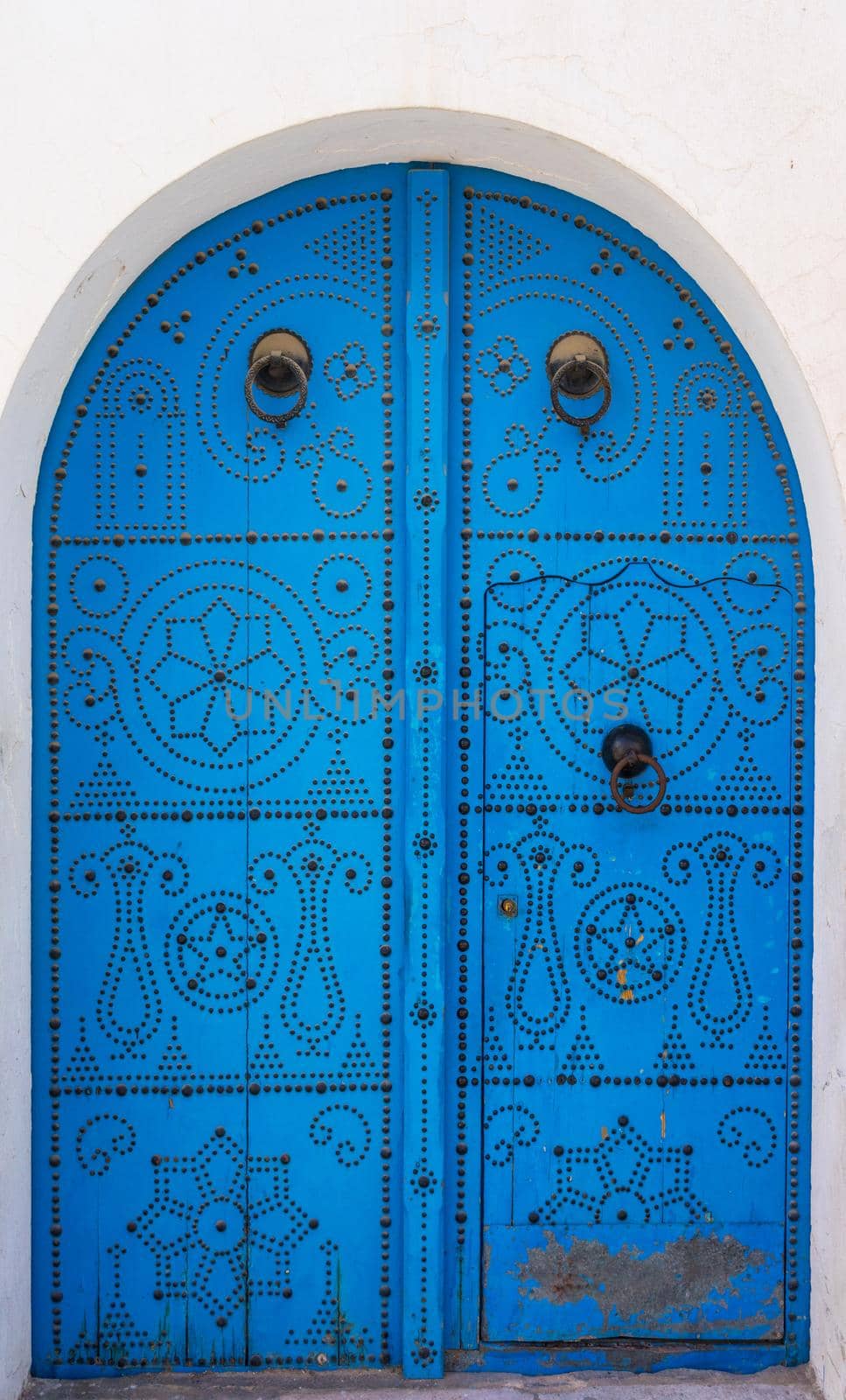 Blue Traditional door with arch from Sidi Bou Said. Tunisian culture and architecture