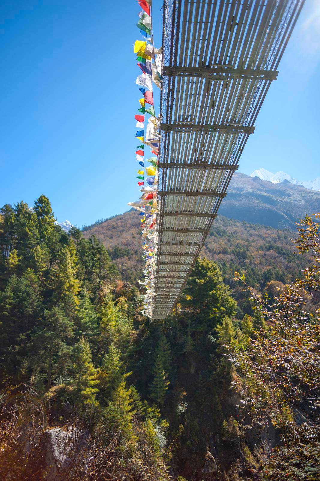 Suspension bridge over the river in Himalayas. Everest base camp trek in Nepal 