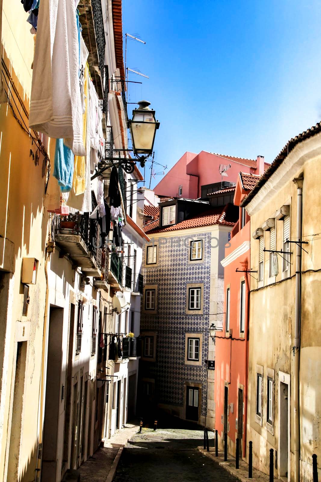 Old colorful houses and narrow streets of Lisbon, Portugal in Spring.