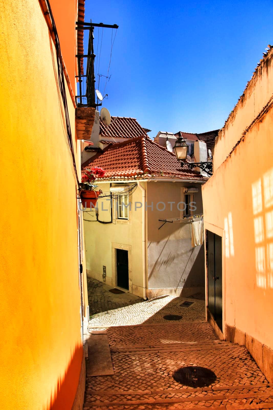 Narrow and colorful streets, majestic facades, windows and balconies of Lisbon, Portugal