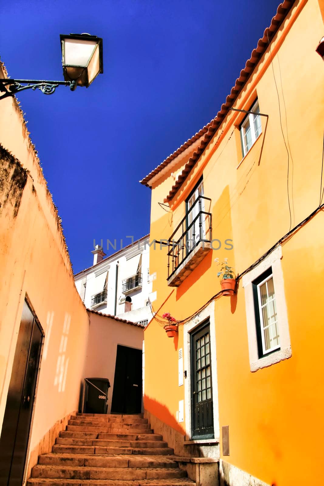 Narrow and colorful streets, majestic facades, windows and balconies of Lisbon, Portugal