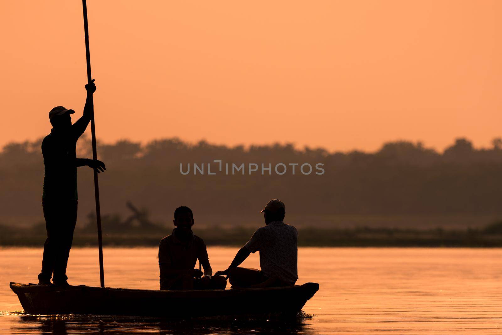 Men in a boat on a river silhouette by Arsgera