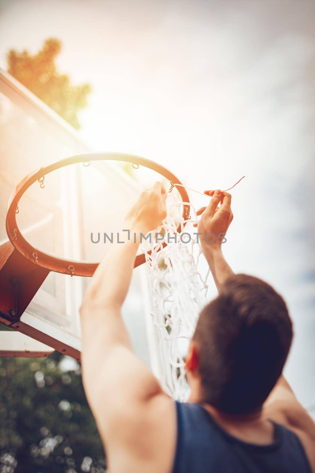 Installation Of Basketball Net On The Hoop by MilanMarkovic78
