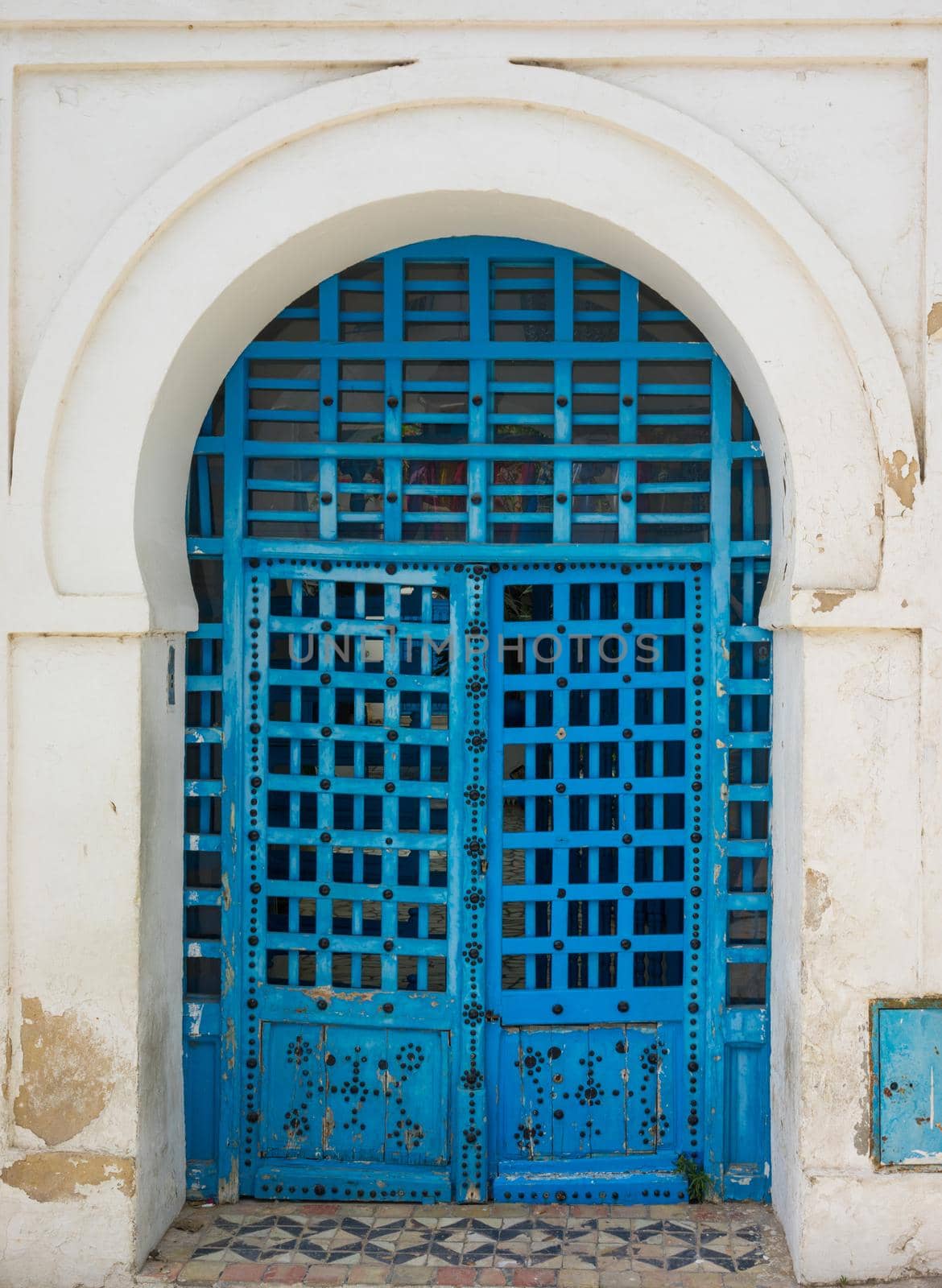 Blue aged door with ornament from Sidi Bou Said