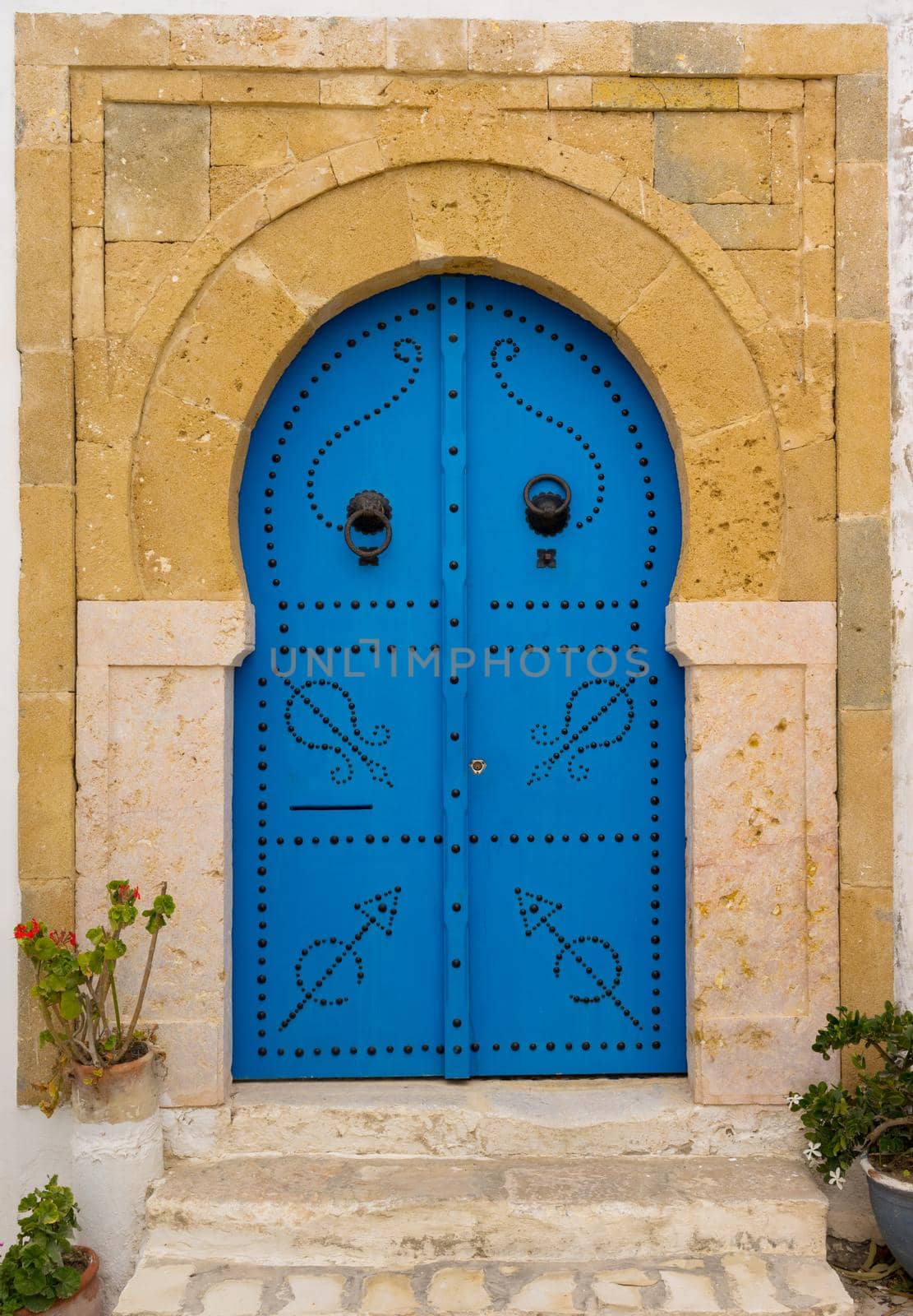 Old Blue door with arch from Tunisia by Arsgera