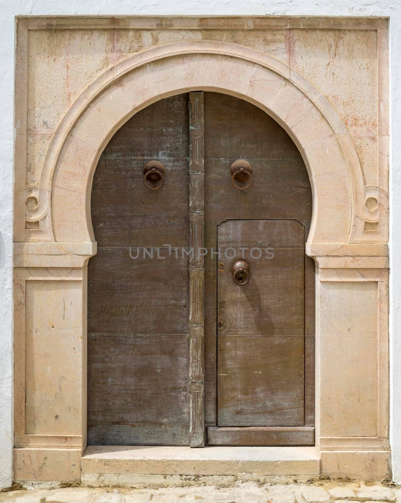 Aged door in Andalusian style from Sidi Bou Said in Tunisia