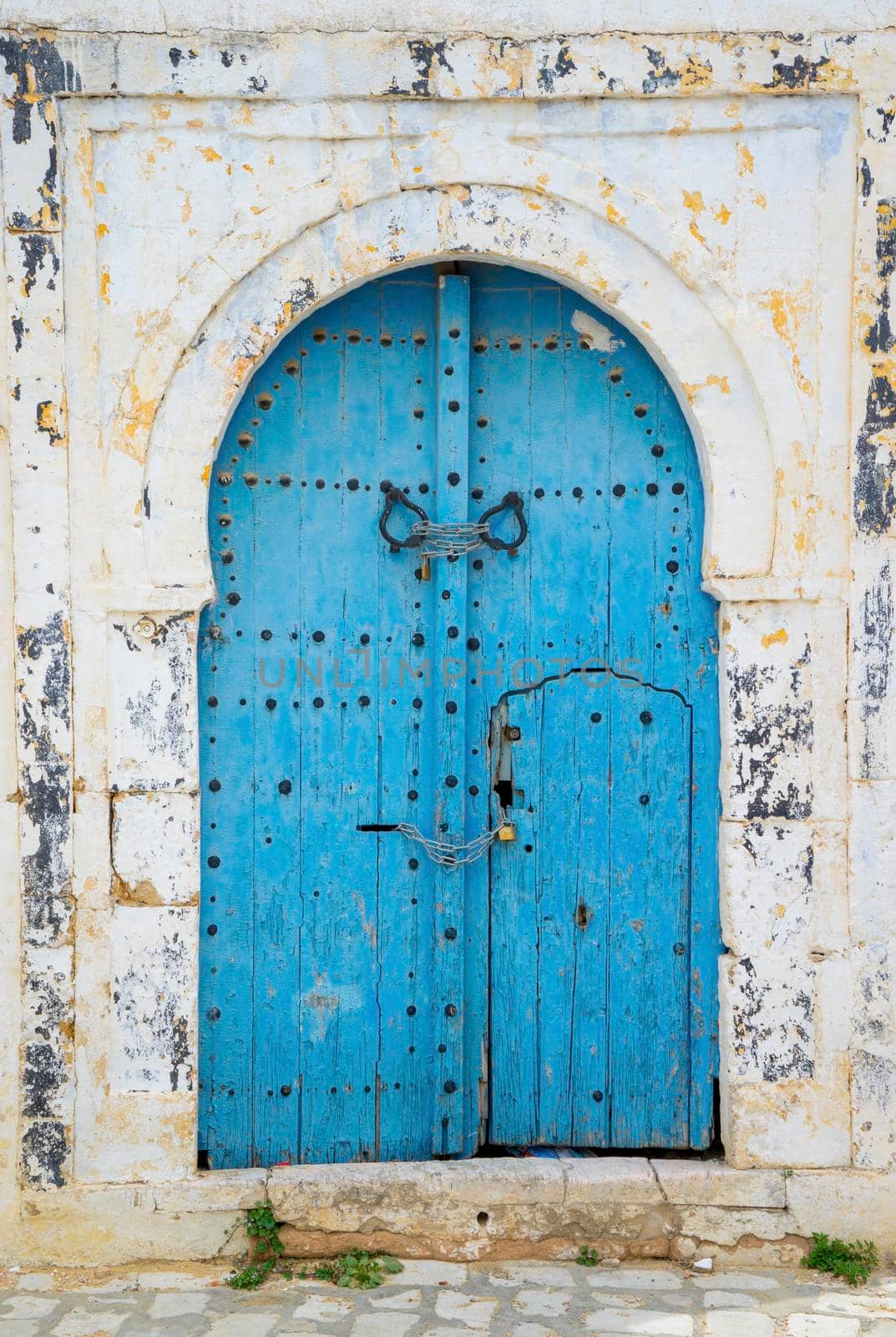 Aged Blue door in Andalusian style from Sidi Bou Said in Tunisia