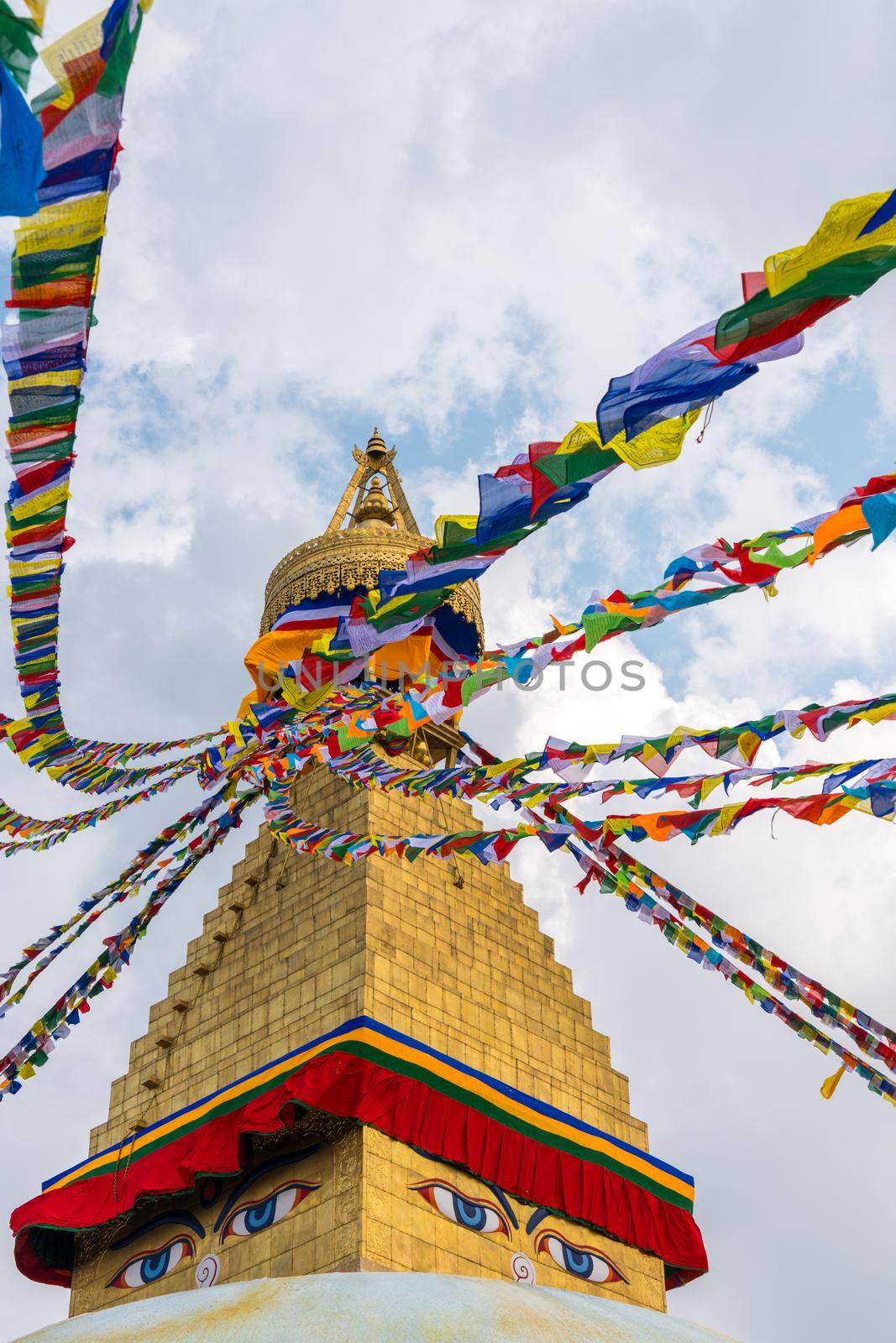 Boudhanath Stupa and prayer flags in Kathmandu, Nepal. Buddhist stupa of Boudha Stupa is one of the largest stupas in the world