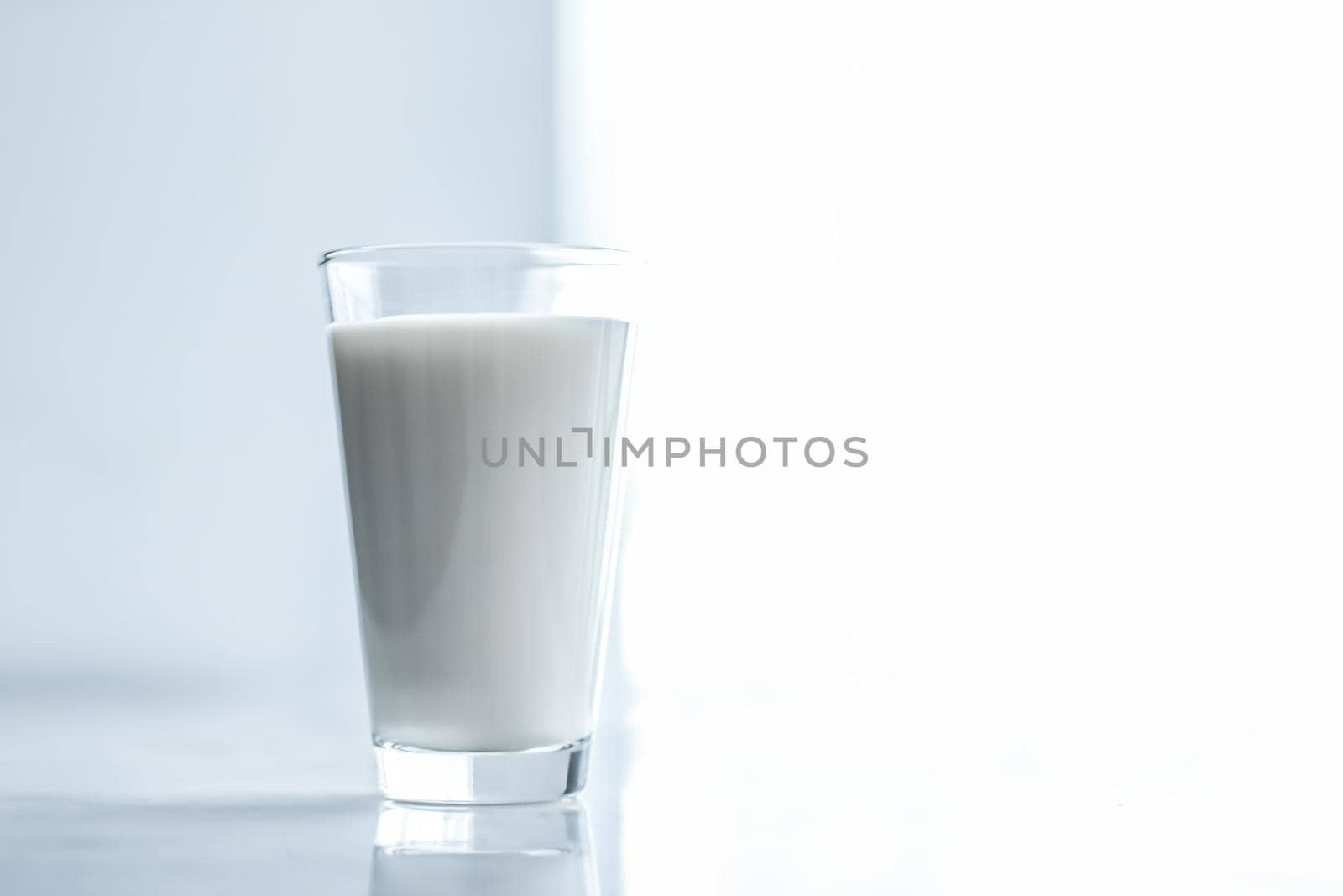 World Milk Day, full glass on marble table by Anneleven