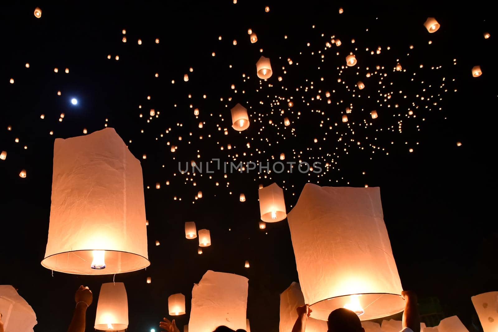 Floating lanterns on sky in Loy Krathong Festival by NuwatPhoto