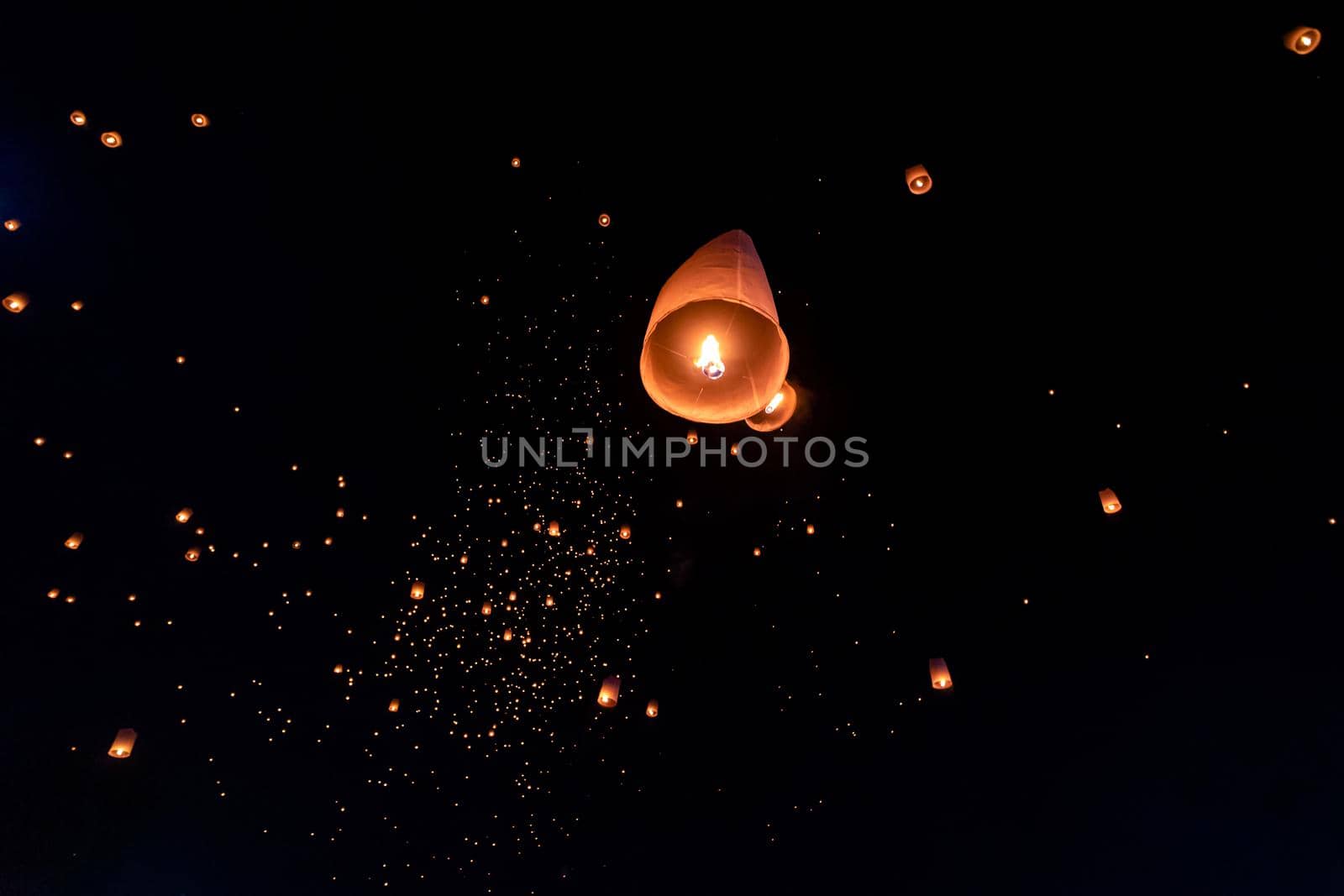 Floating lanterns on sky in Loy Krathong Festival by NuwatPhoto