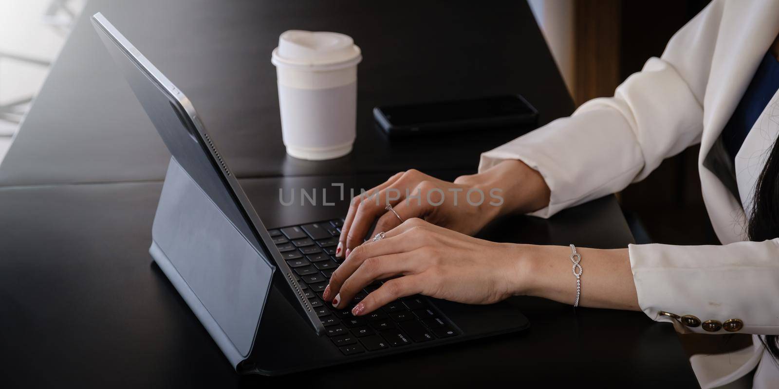 Business woman using bank savings account application in digital tablet, account or saving money or insurance concept
