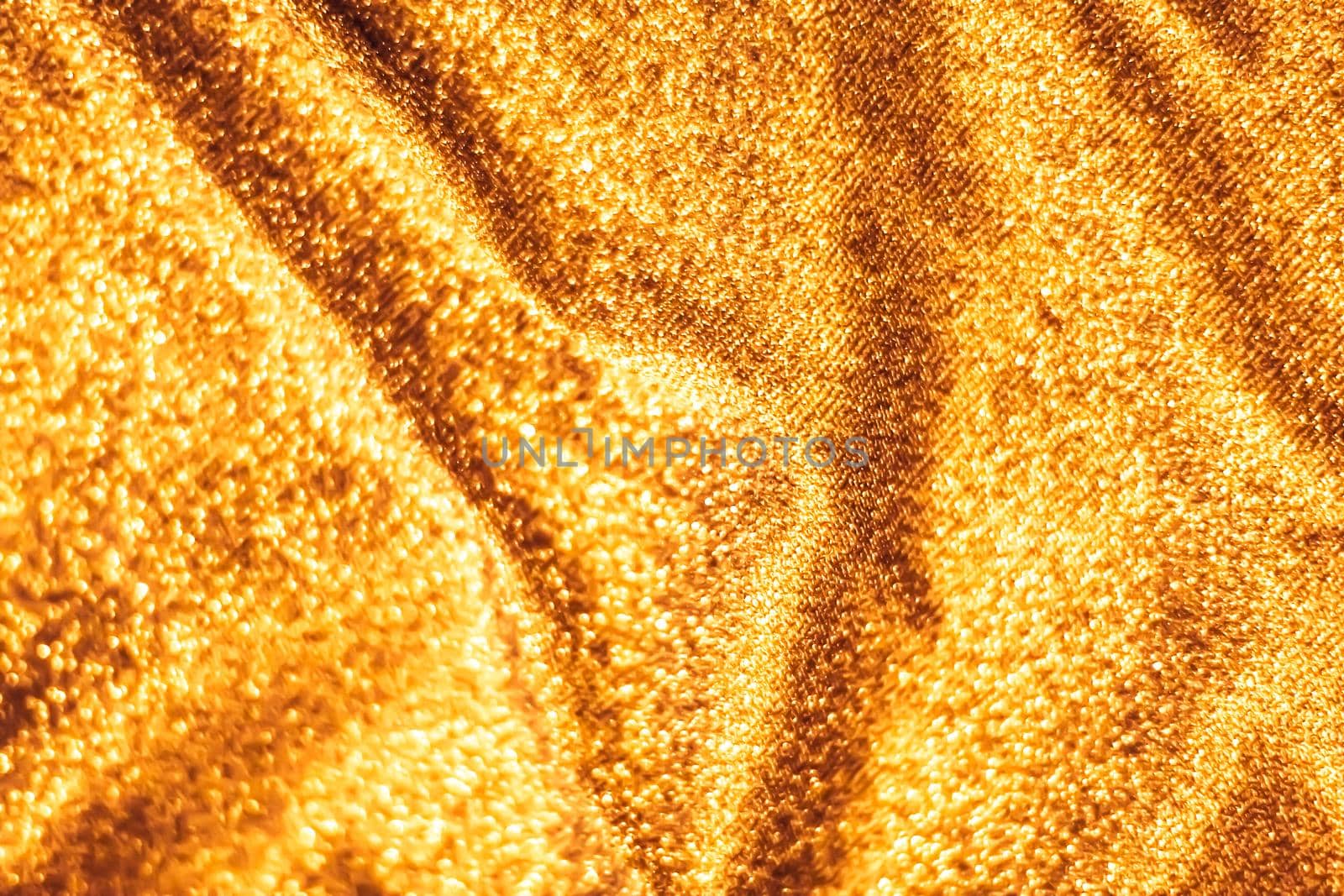 Golden holiday sparkling glitter abstract background, luxury shiny fabric material for glamour design and festive invitation by Anneleven