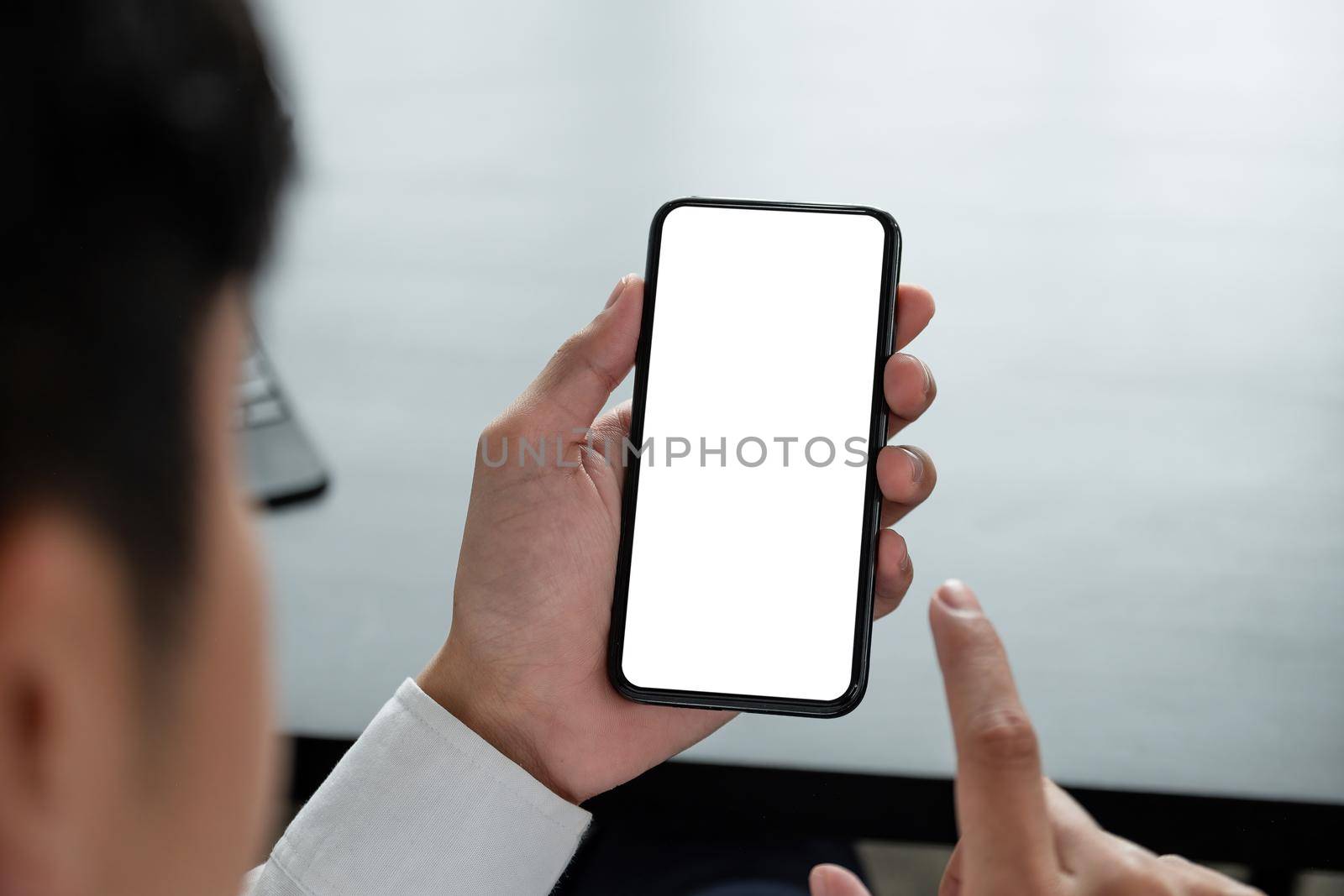 Shot of man holding blank screen mock up mobile phone