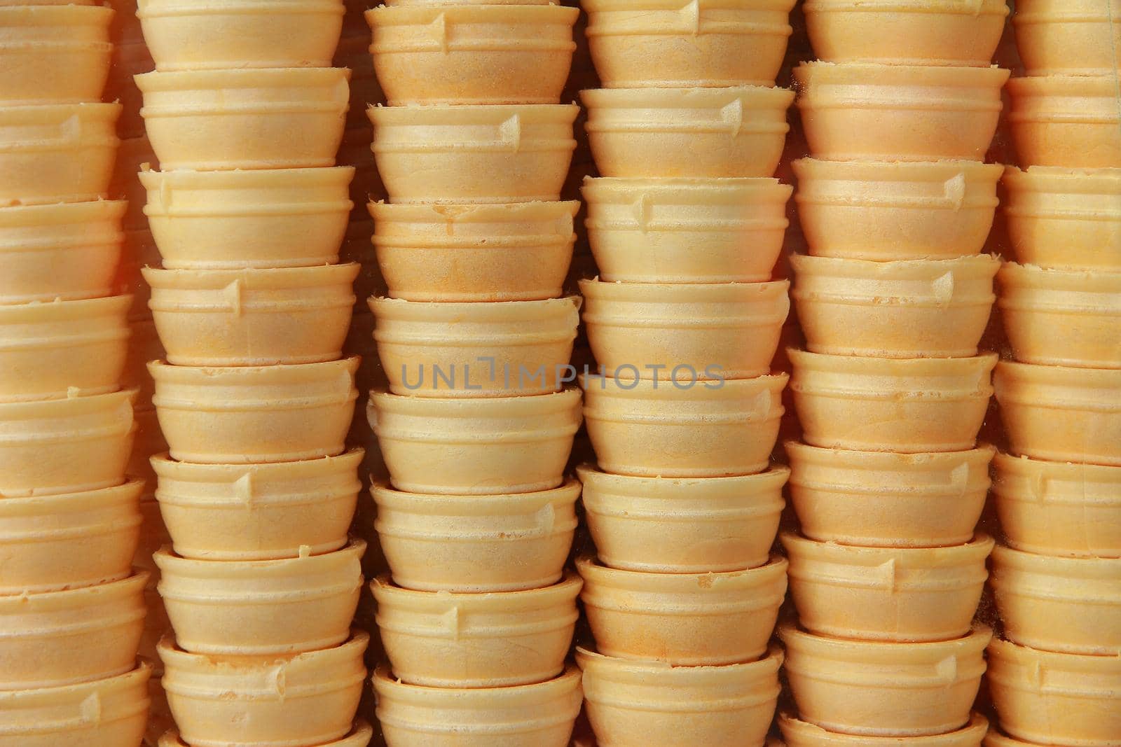 Background of ice cream cones. In a row.