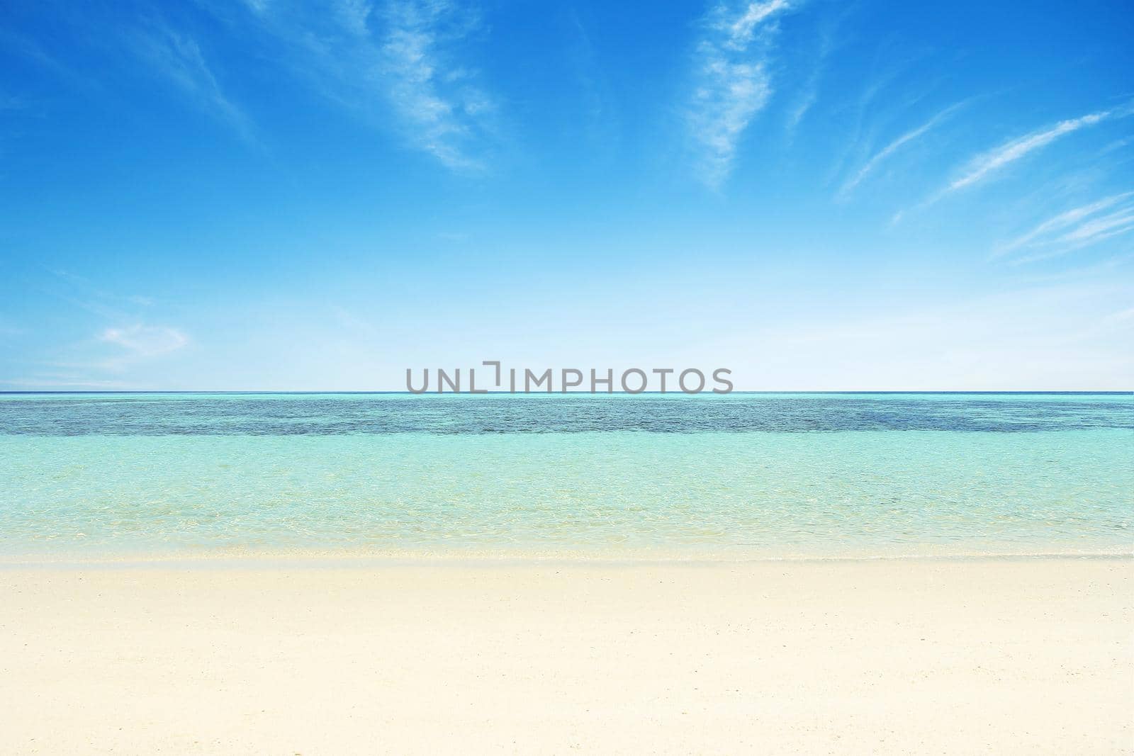 Beaches, crystal clear water, blue sky as background.