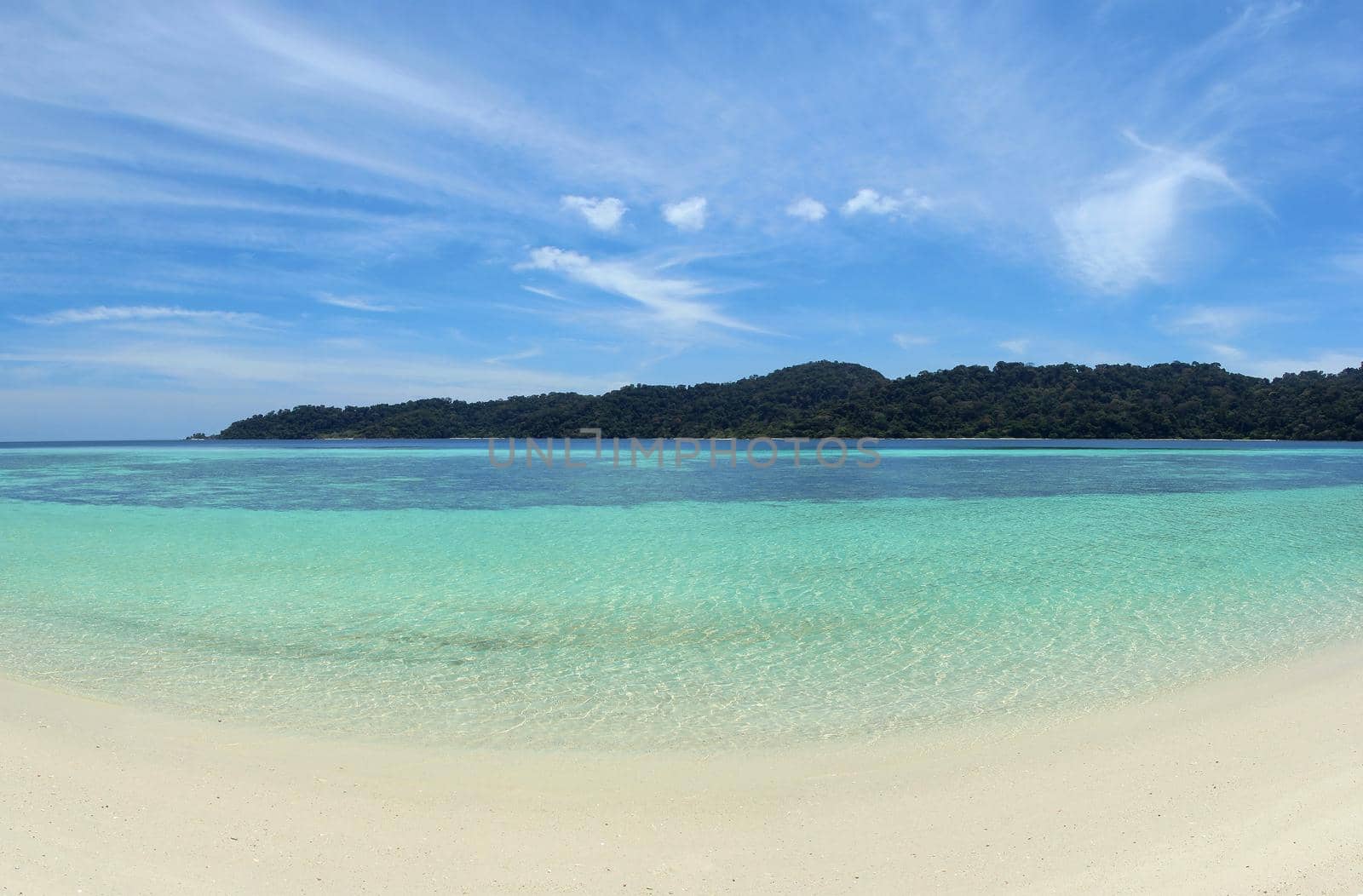 Background clean sea sand and sky islands.