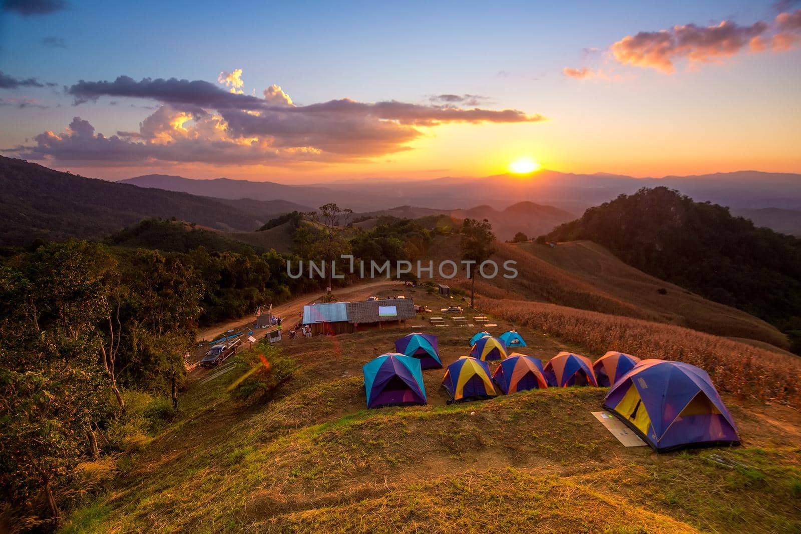 Activities tent on a hill in the countryside.