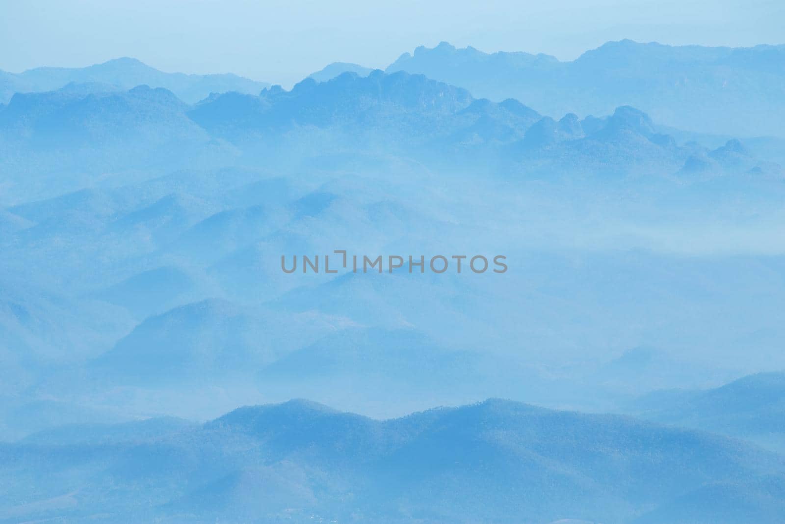 mountains under mist in the morning.