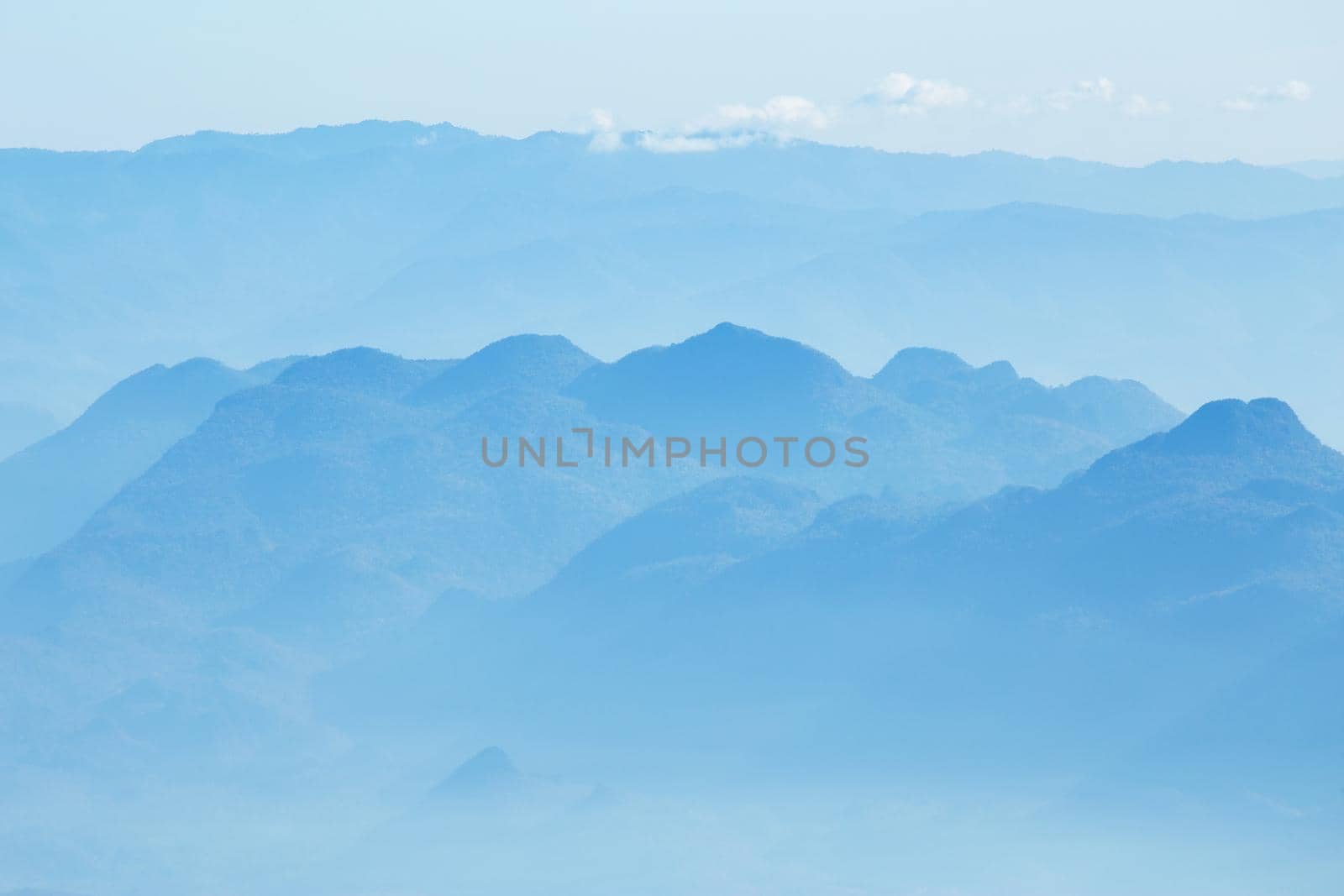 mountains under mist in the morning.