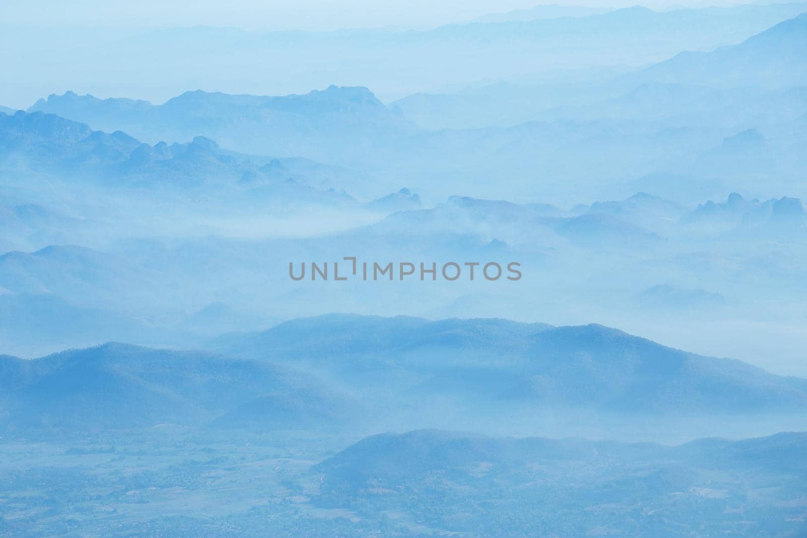 mountains under mist in the morning.