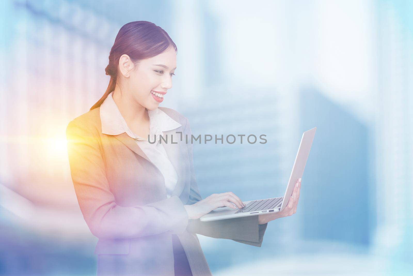 Young pretty business woman with notebook. Double exposure photo of panoramic city