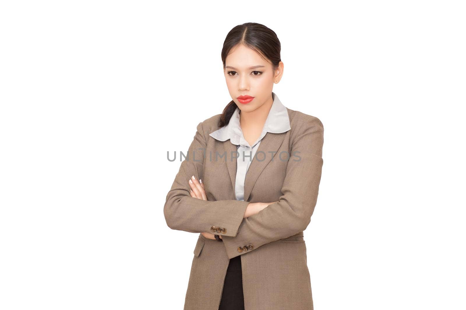 Pretty businesswoman pointing. Isolated on white.