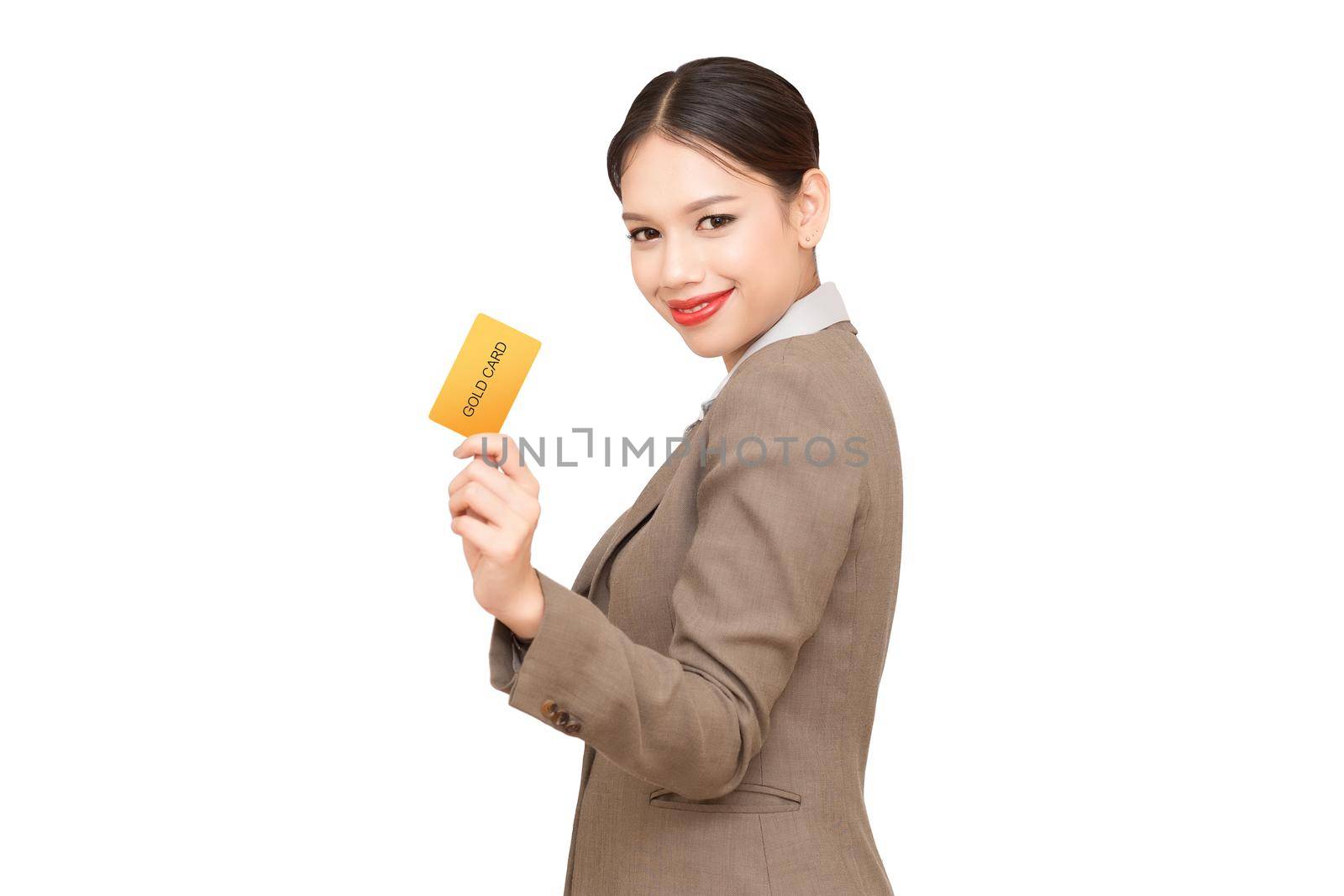 Smiling business woman show credit card.Isolated on white background