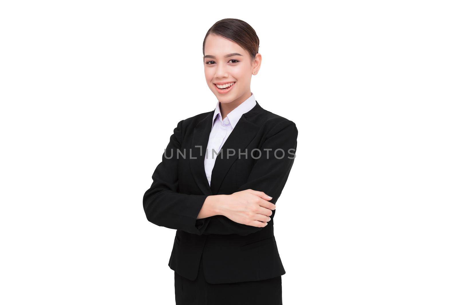 Smiling business woman with folded hands against white background.