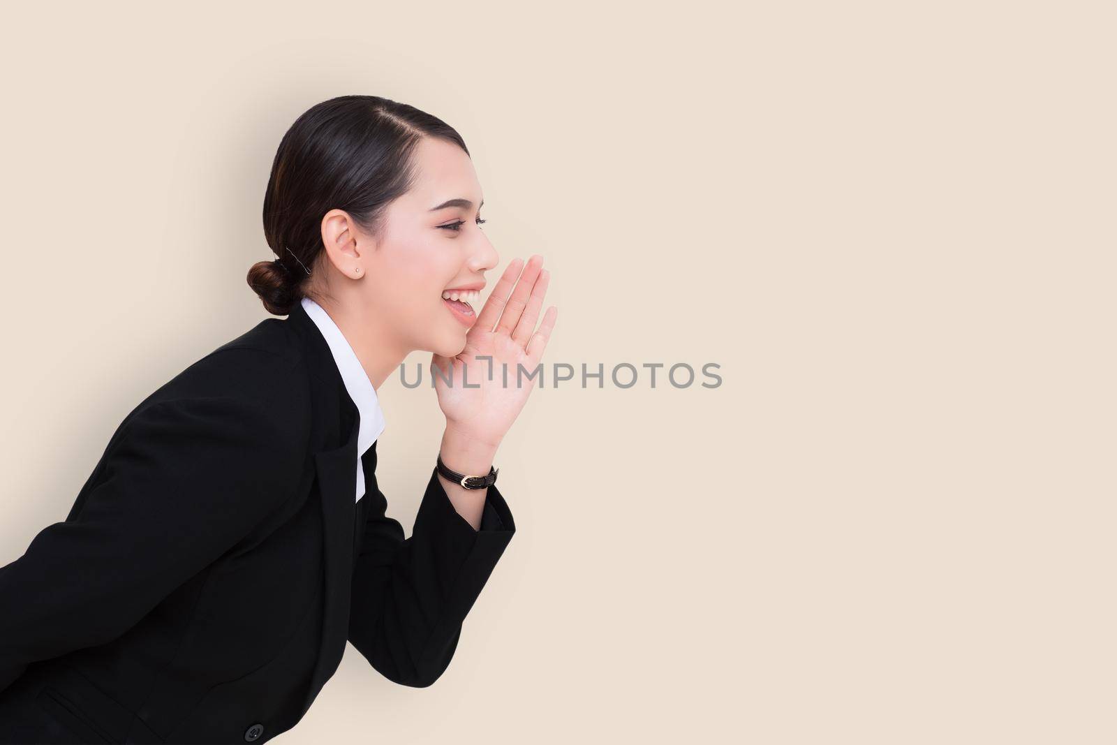 portrait of pretty businesswoman loud screaming or calling out to someone