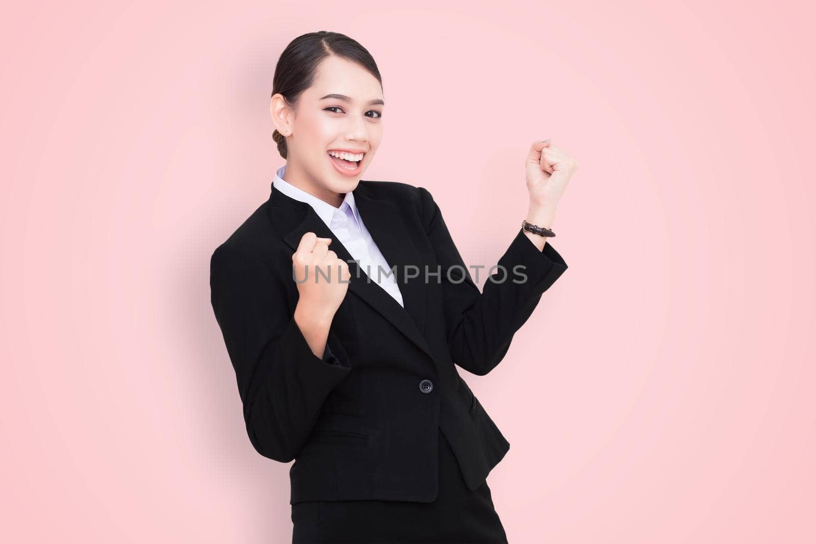 Young Business Woman celebrating a successful work day