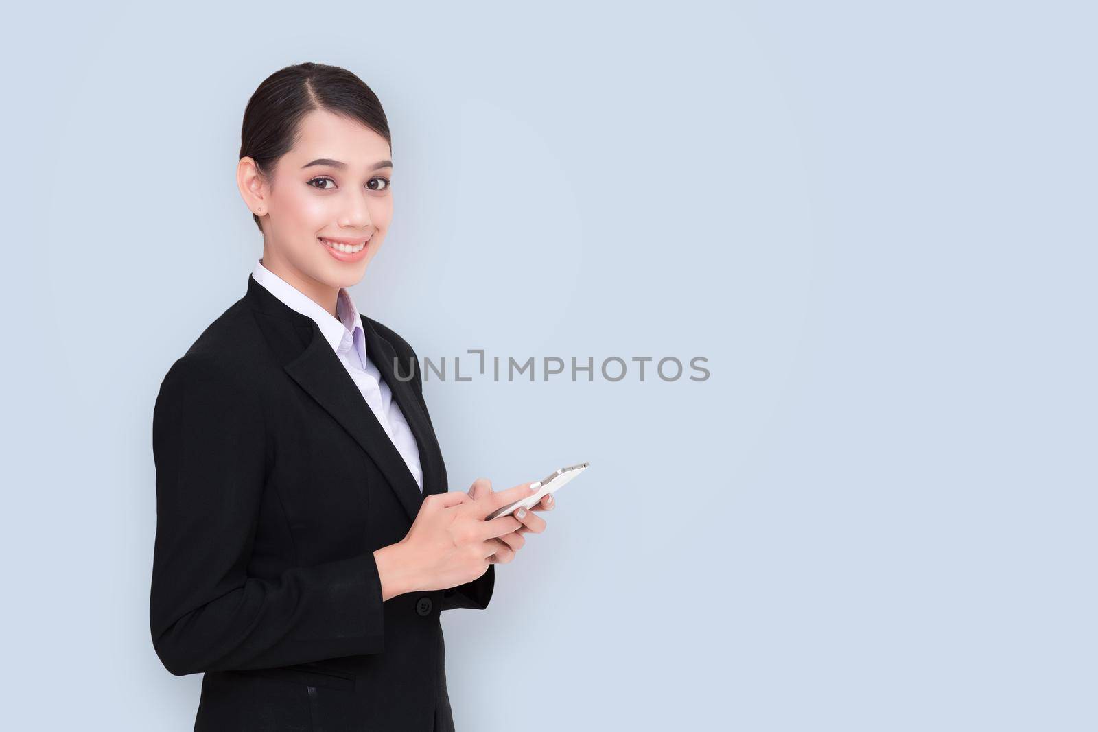 Young Business woman smile use the mobile phone.