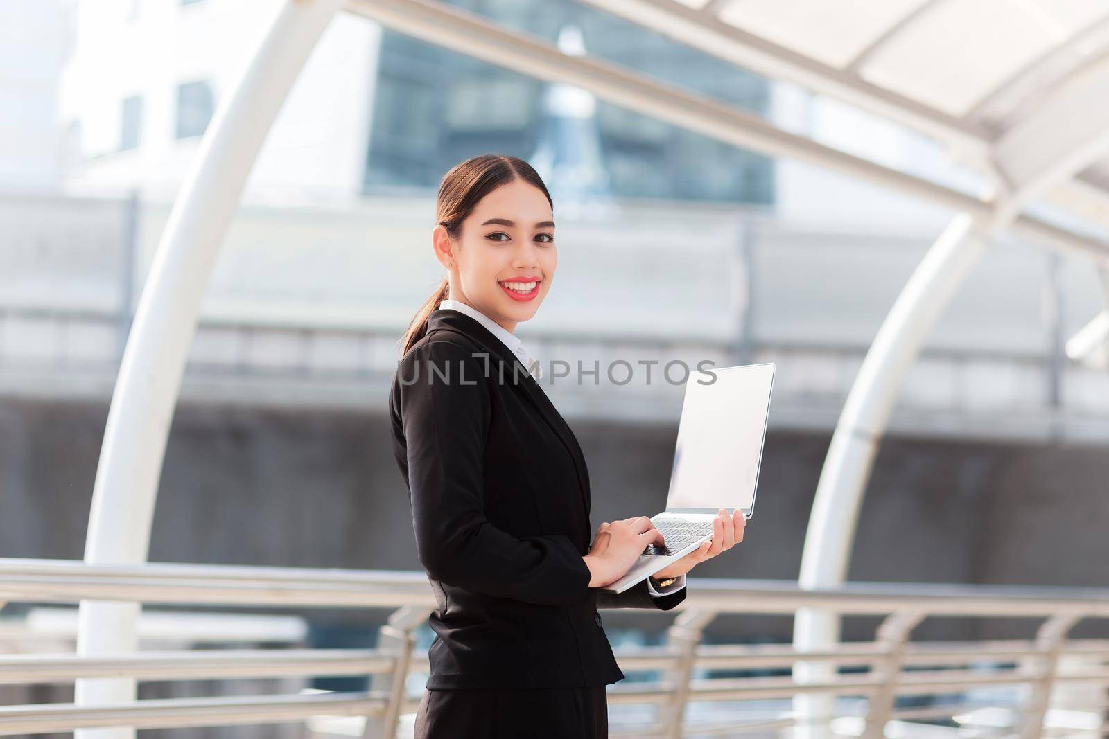 business woman using notebook by samarttiw