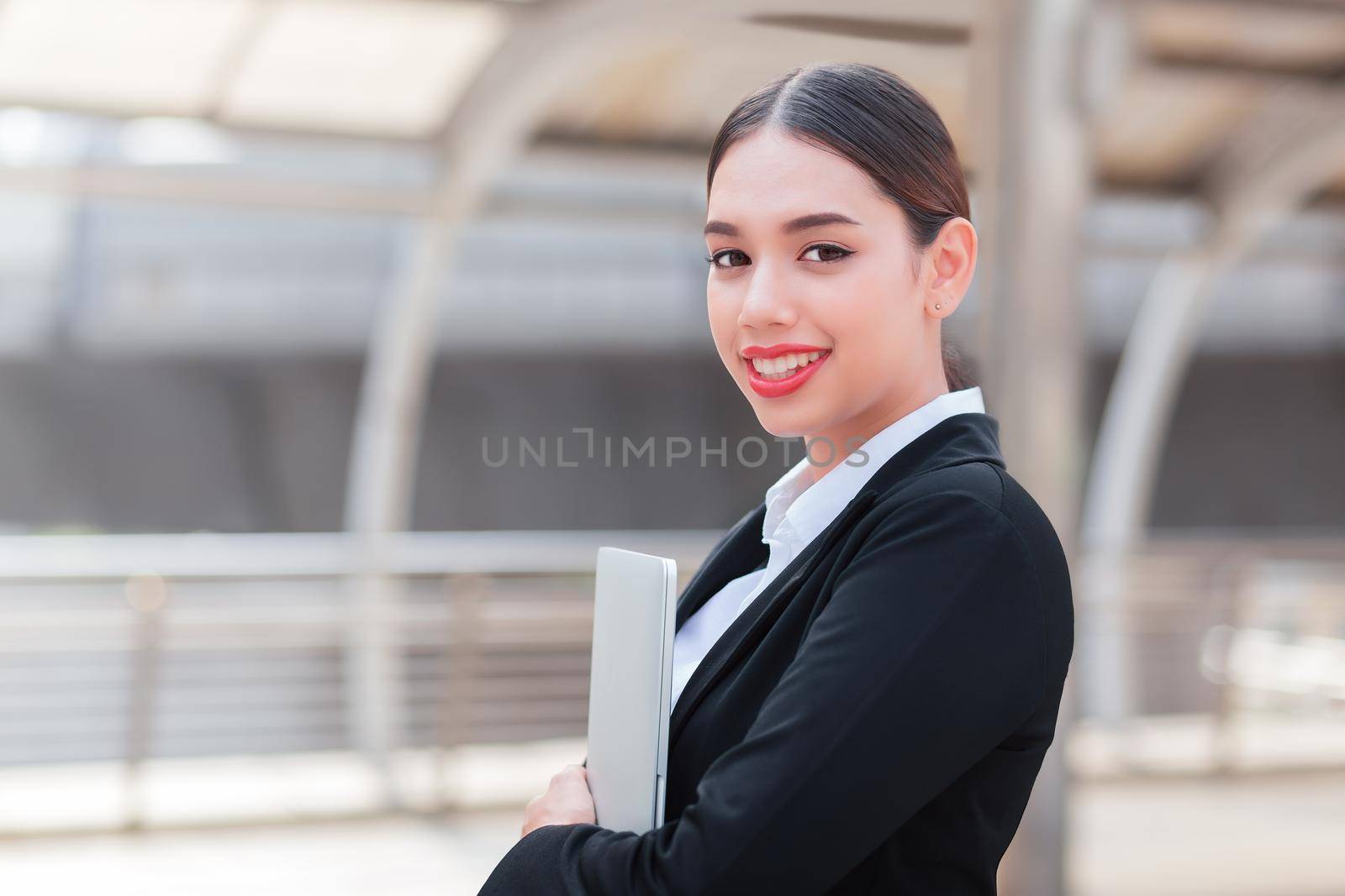 Young business woman using notebook mobile computer