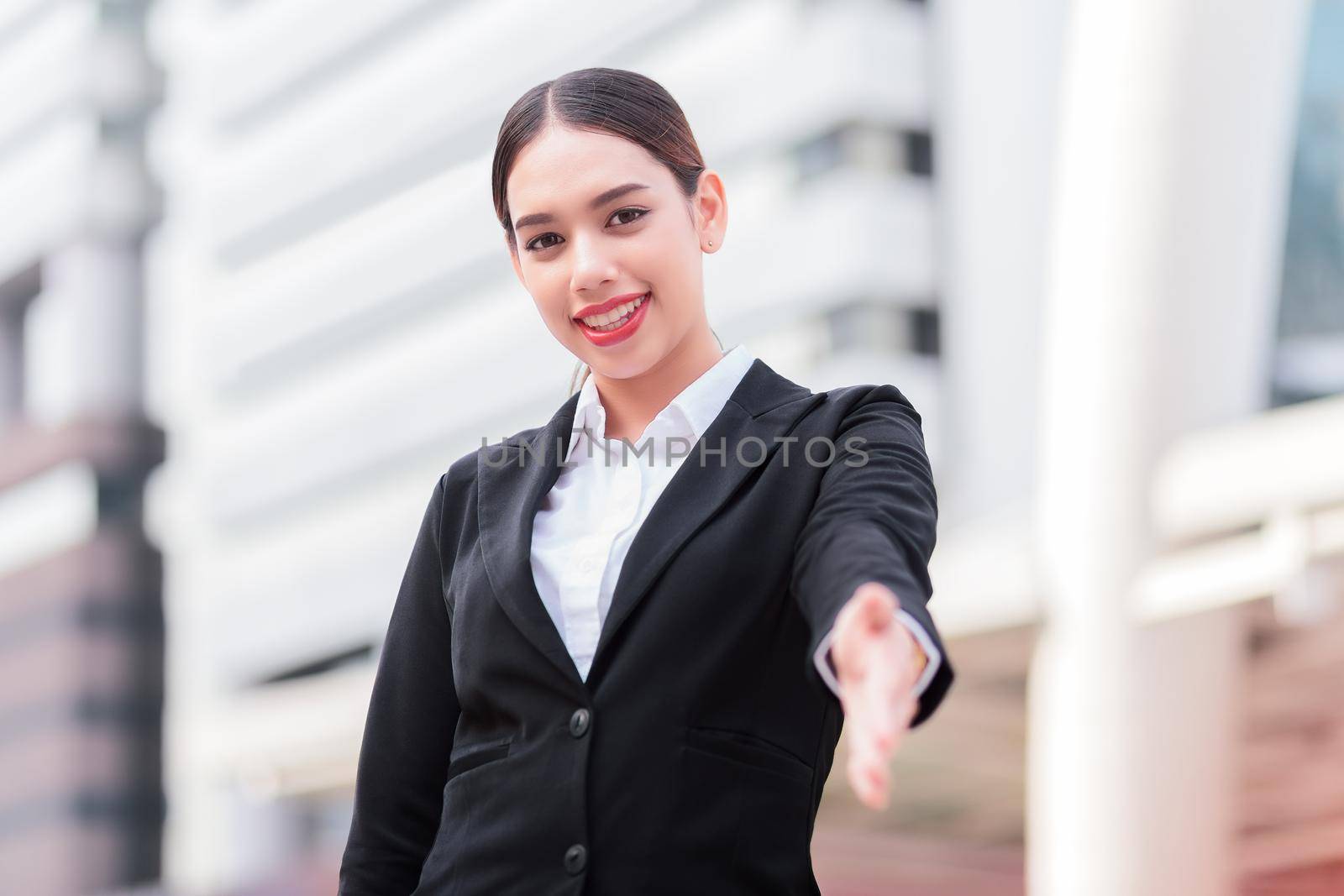 Business woman giving a hand/ handshake